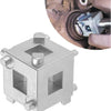A silver cube-shaped piston tool used for brake caliper work, shown next to a close-up of a brake caliper assembly.