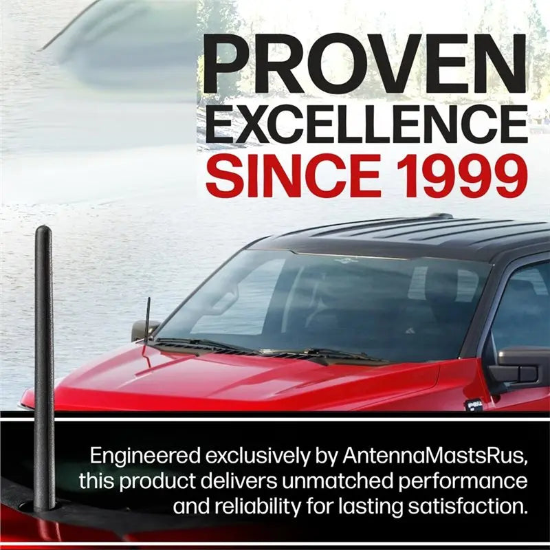 A red Ford F-150 truck with a black antenna mast installed on the roof, set against a blurred water background.