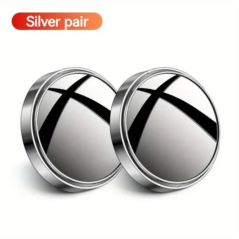 A pair of silver blind spot mirrors with a cross design.