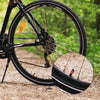 Close-up of a bicycle wheel showing an aluminum tire valve cap set.