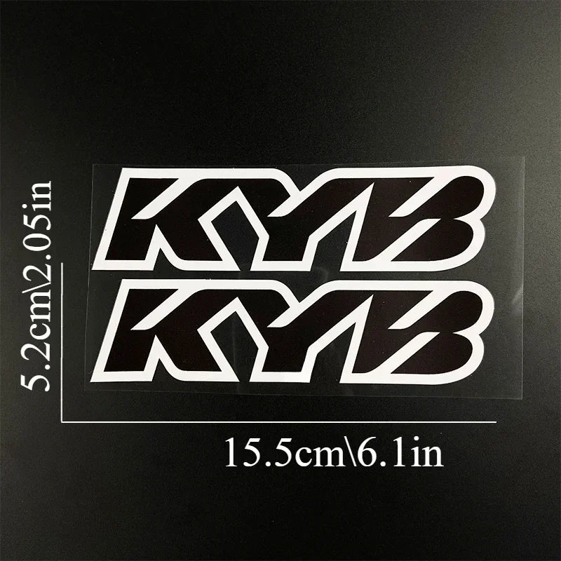 Black and white racing suspension decals featuring the KYB logo on a clear background.