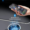 A hand holds a smartphone near a Bluetooth 5.3 transmitter device for car audio transmission.