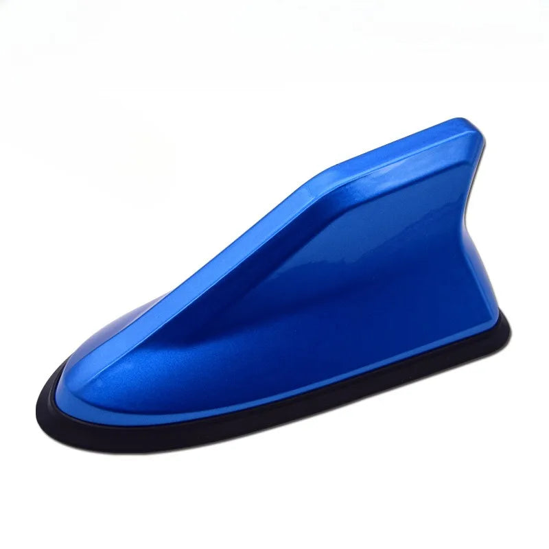 A blue shark fin universal car antenna amplifier with a black base.