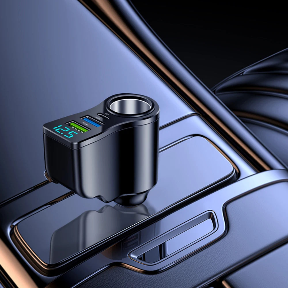 A close-up view of a black car charger adapter with dual USB ports resting on a metallic surface.