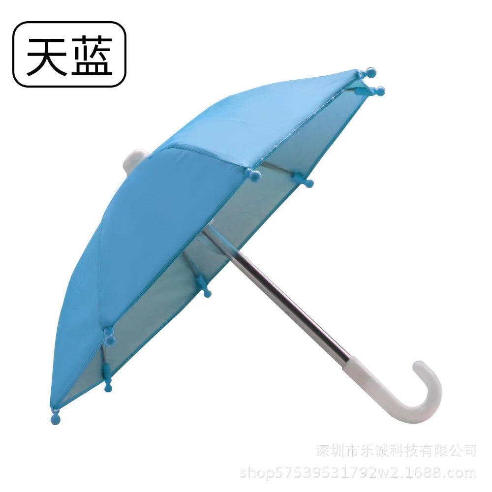 A light blue mini motorcycle sunshade umbrella with a silver handle.