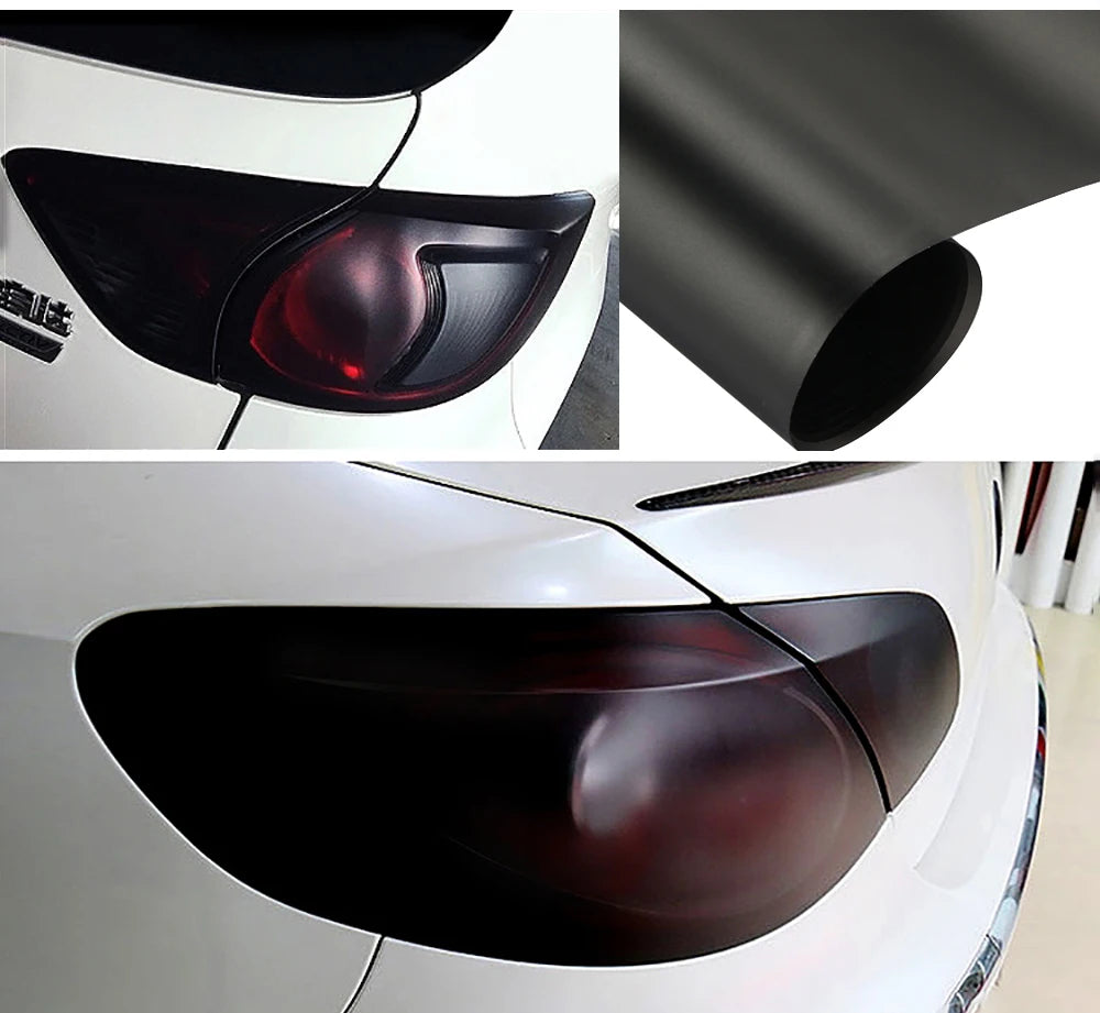 Close-up view of a black smoke tint vinyl decal applied to a car headlight lens.