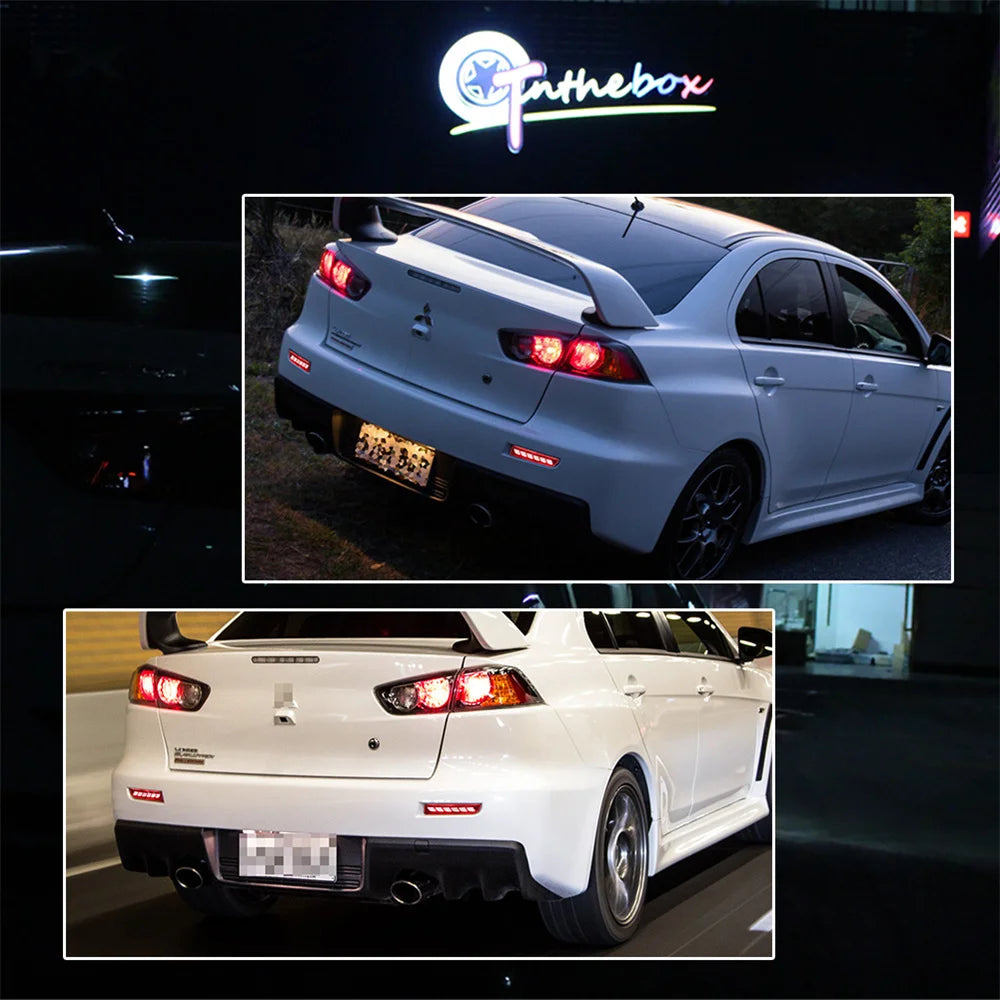 A white Mitsubishi Lancer Evolution X with aftermarket LED rear bumper reflector lights and sequential turn signals.