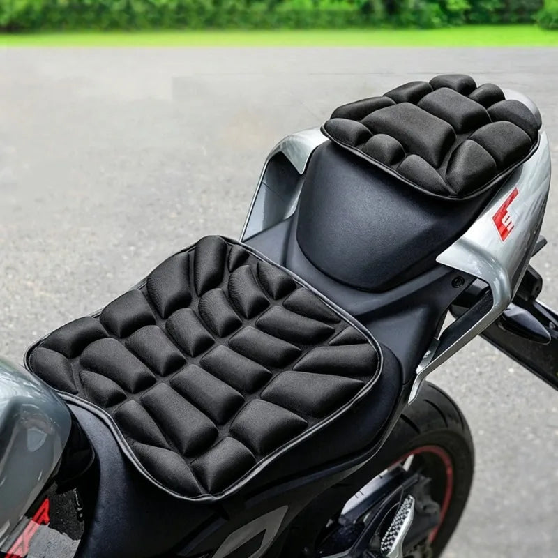 Black quilted seat covers installed on a motorcycle or electric bike.