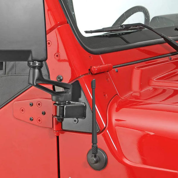 A close-up view of a red vehicle interior showing an installed universal car antenna.