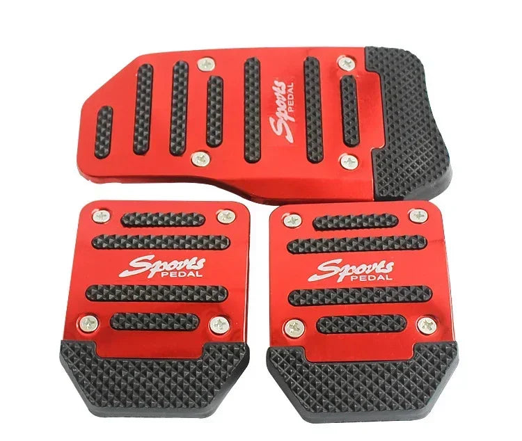 A set of red and black aluminum pedal covers for a car pedal.