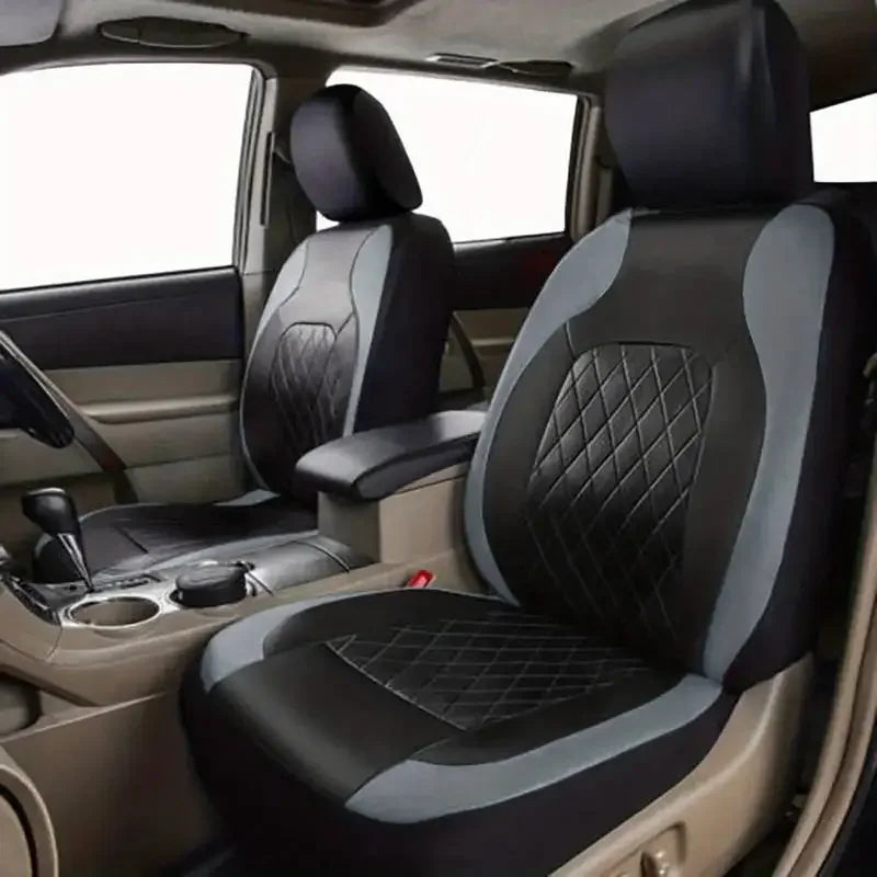 Interior view of a car with black and gray full coverage PU leather seat covers installed on the front seats.