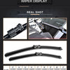 A collection of various sized wiper blades for a car windshield, shown in close-up and full view.