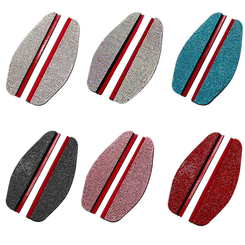 A set of four rhinestone car rain shield visors in silver, purple, teal, and red.