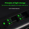 Close-up of car window luminous button stickers showing green light storage principle