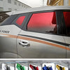 Close-up view of a silver car window with a red tint film applied to the glass.