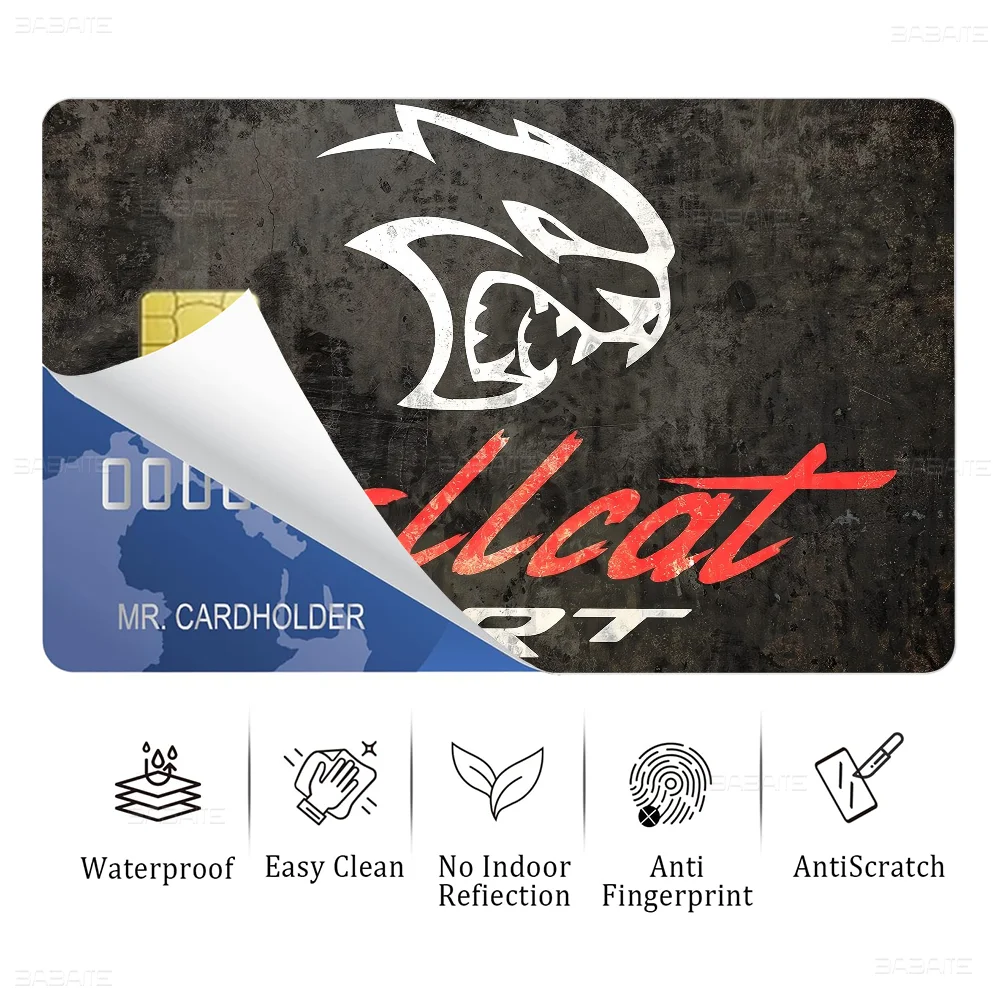 A close-up of an SRT Hellcat Demon Dodge card sticker film featuring a stylized black and white dragon head logo on a dark ba
