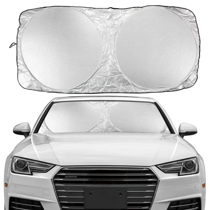 A set of six clear plastic car windshield sun shades shown above a white car.