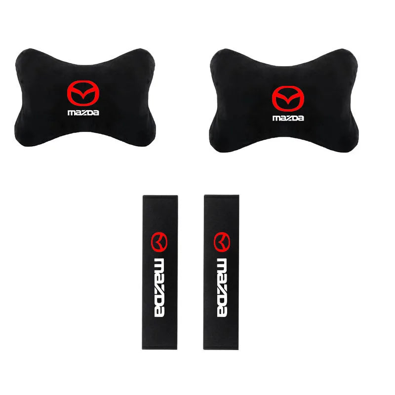 Black car headrest seat belt shoulder pads featuring the Mazda logo.
