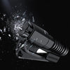 A black emergency car escape tool is shown exploding with shards of glass and metal against a dark background.