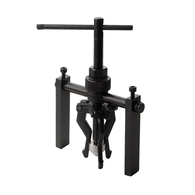 A black three-claw bearing puller tool with a long shaft and gripping mechanism.