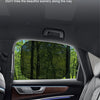 Interior view of a car showing a side window with a sunshade installed, emphasizing the view outside.