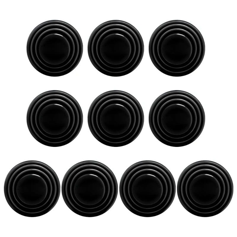 Un juego de juntas de absorción de choque para puertas de coche negras dispuestas en una cuadrícula.