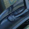 A close-up view of a black universal windshield wiper protective cover attached to a vehicle's wiper arm.