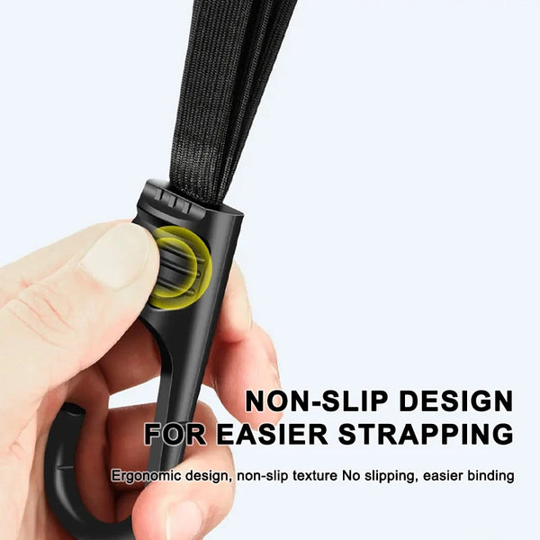 A hand is demonstrating a black heavy duty motorcycle seat strap kit with an ergonomic, non-slip design.