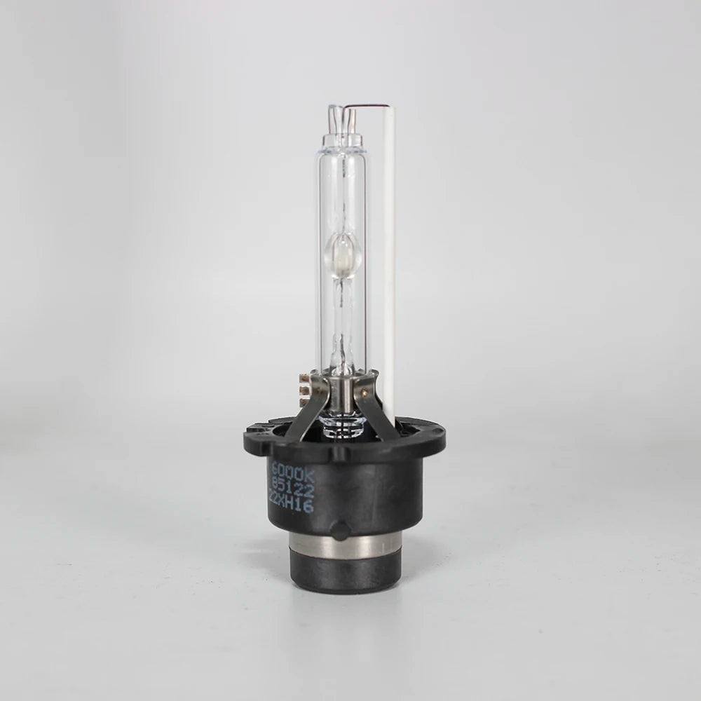 A clear glass xenon HID bulb and its mounting base are shown against a white background.