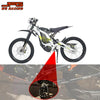 A white motorcycle is shown with heavy-duty CNC foot pegs installed on the bike's frame.