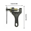 A black universal chain breaker tool with a metal rod and a threaded mechanism for removing motorcycle, bicycle, or ATV chain