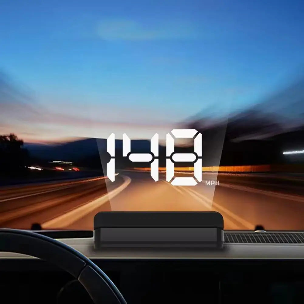 Car dashboard display showing speed 148 MPH on a digital screen during a drive.