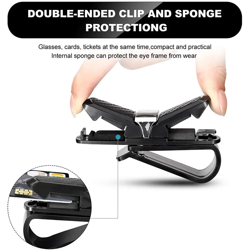 A black double-ended clip and sponge protection for glasses and cards, shown being held by a hand.