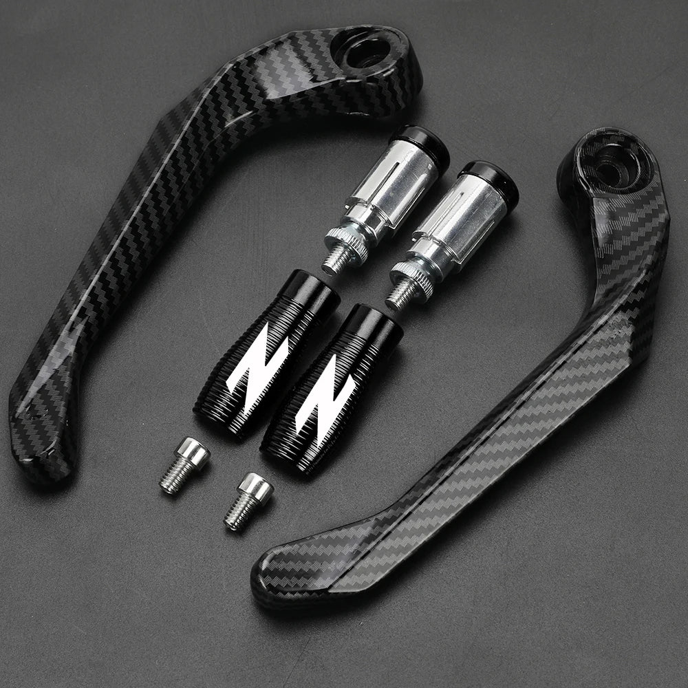 A set of black carbon fiber motorcycle levers and handguard protectors displayed on a dark background.