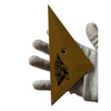 A gold-colored triangle shaped squeegee tool is held by a hand, demonstrating its size and shape.