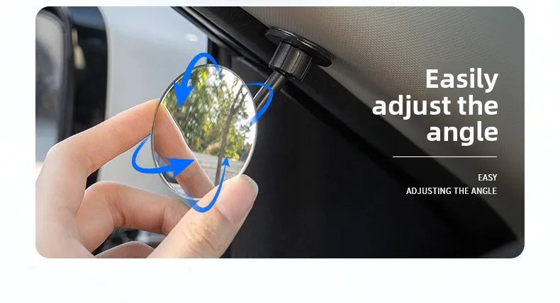 A hand adjusts the angle of a 360° adjustable car reverse mirror for blind spot assistance.