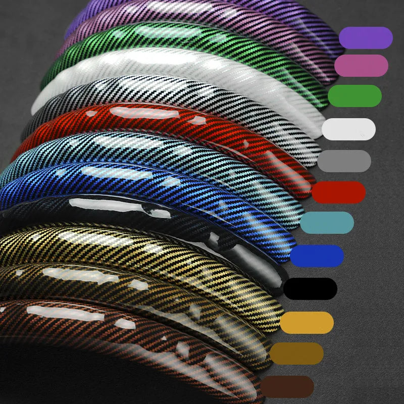Collection de protections de volant en fibre de carbone dans un spectre de couleurs dégradé.