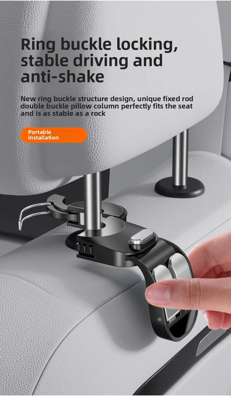 Close-up of a black ring buckle hook being installed onto a light gray car seat fabric.