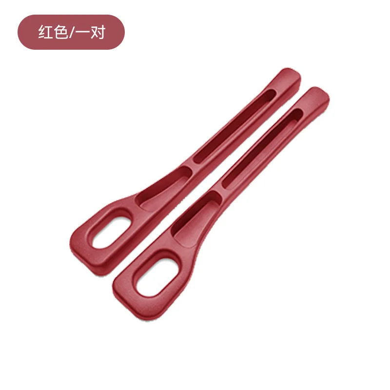 A pair of red car seat gap plug strips used for protection.