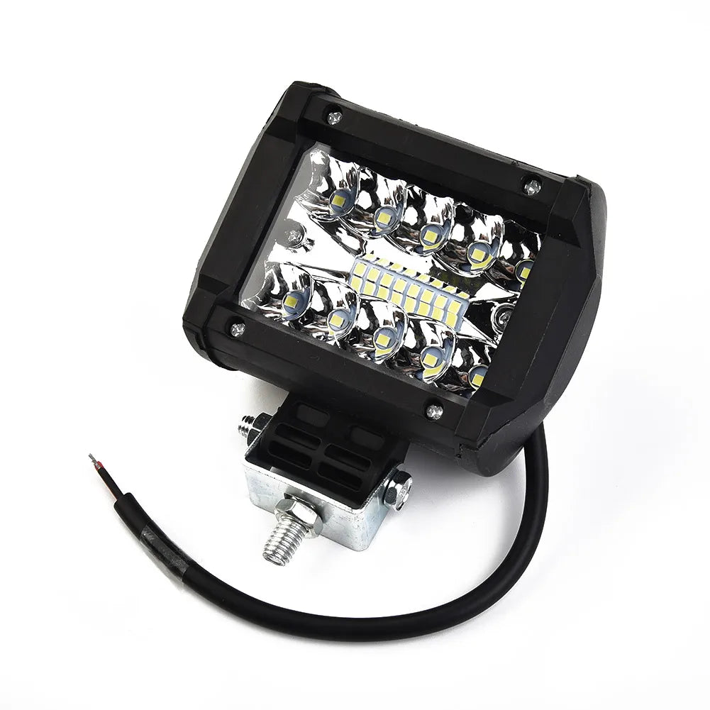 A black high-intensity LED off-road flood bar with multiple bright lights and an electrical connector cable.
