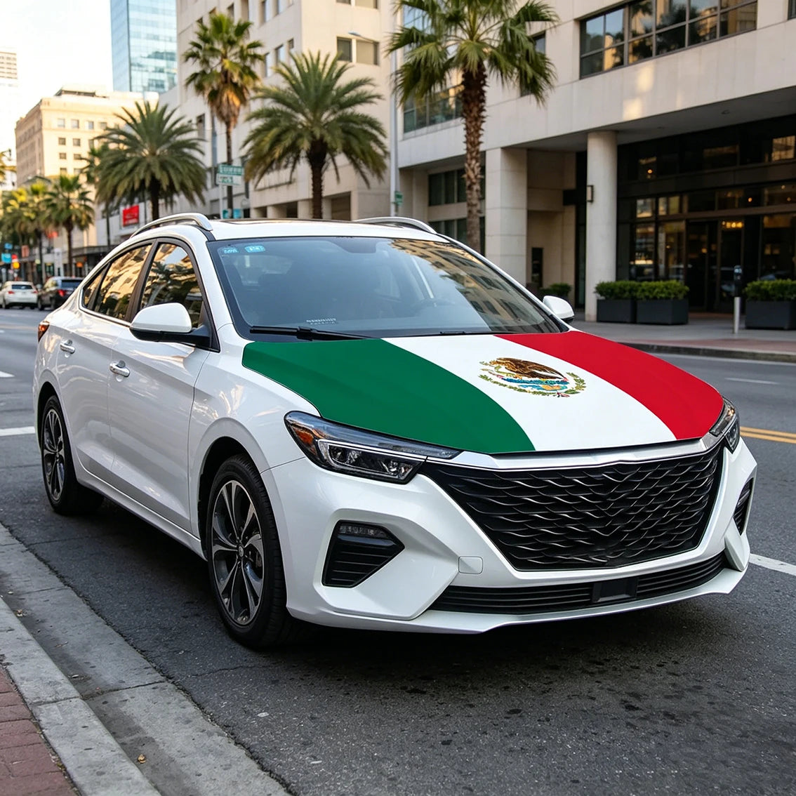 A white sedan with a Mexican flag design on the hood is parked on a city street.