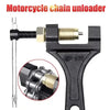 A black motorcycle chain unloader tool with a metal rod and a specialized jaw for breaking chains.