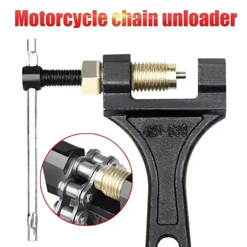 A black motorcycle chain unloader tool with a metal rod and a specialized jaw for breaking chains.