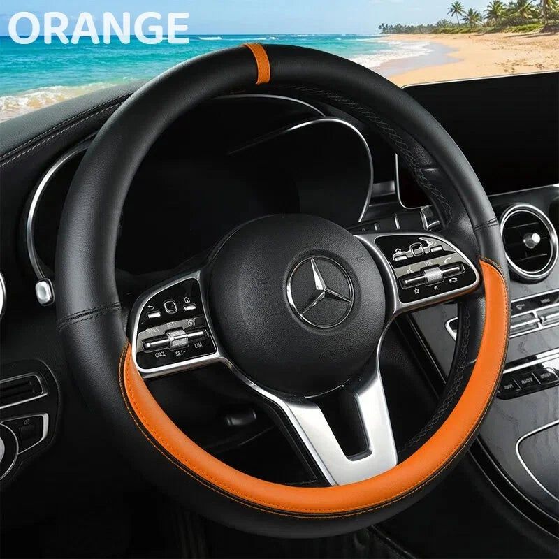 Orange leather steering wheel cover for a Mercedes vehicle interior.