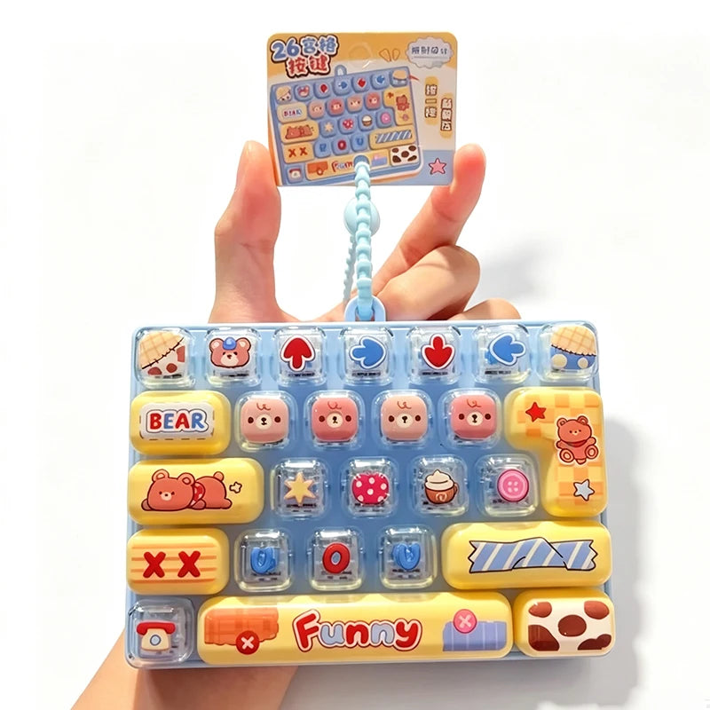 A set of colorful cartoon keycap stress relief buttons and a guide are shown being held by a hand.