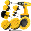 An orange electric tool is shown with various yellow and black cleaning brushes attached.