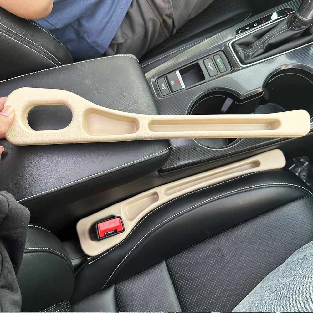 A beige gap filler strip is shown in the interior of a car seat, resting on the leather upholstery.