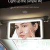 An HD sun visor LED makeup mirror is shown mounted in a car interior, illuminating a woman's face.