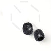 A set of black crystal diamond finish tire valve caps.