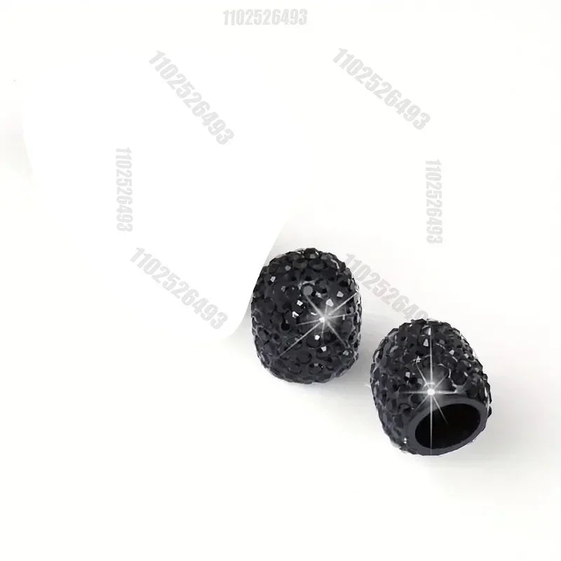 A set of black crystal diamond finish tire valve caps.